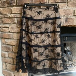 Angie black lace skirt with gold lining, with black Sequin. Size small